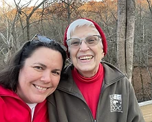 Anita outdoors with a companion