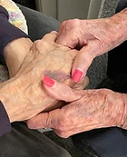 Two people holding hands